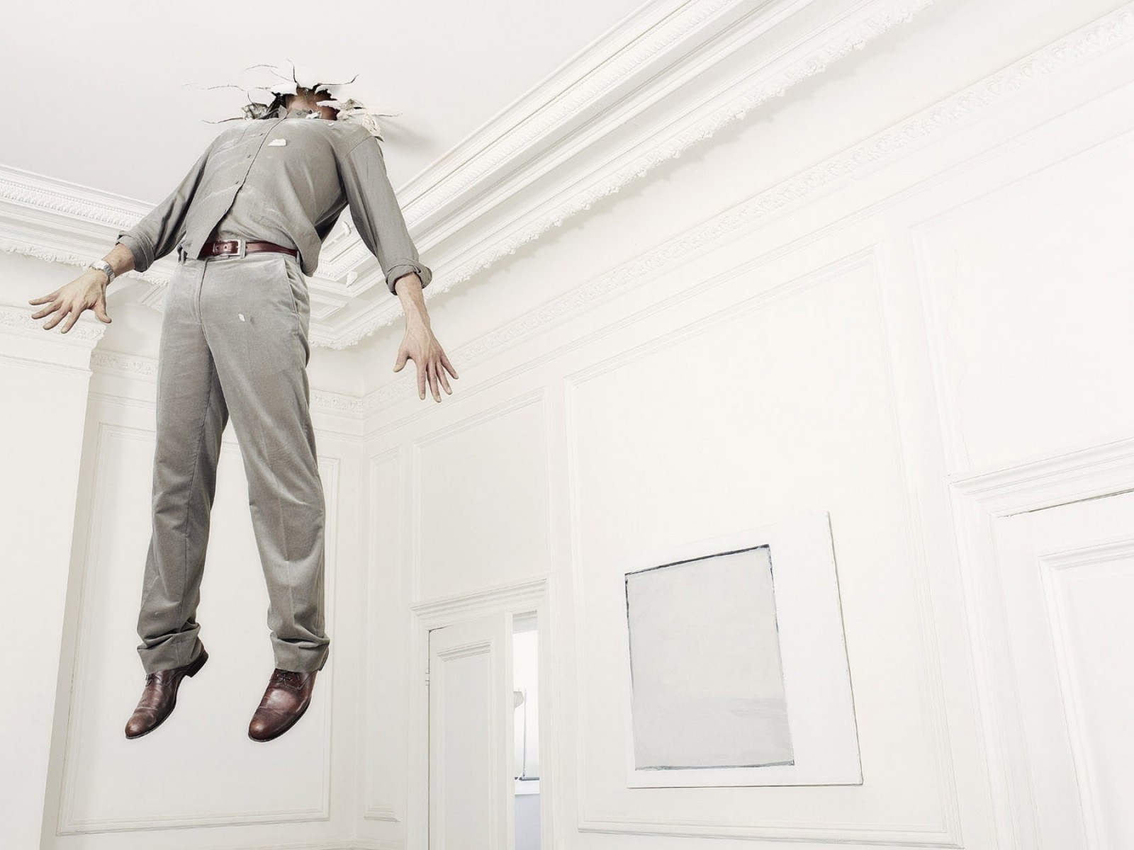 Man breaking through ceiling