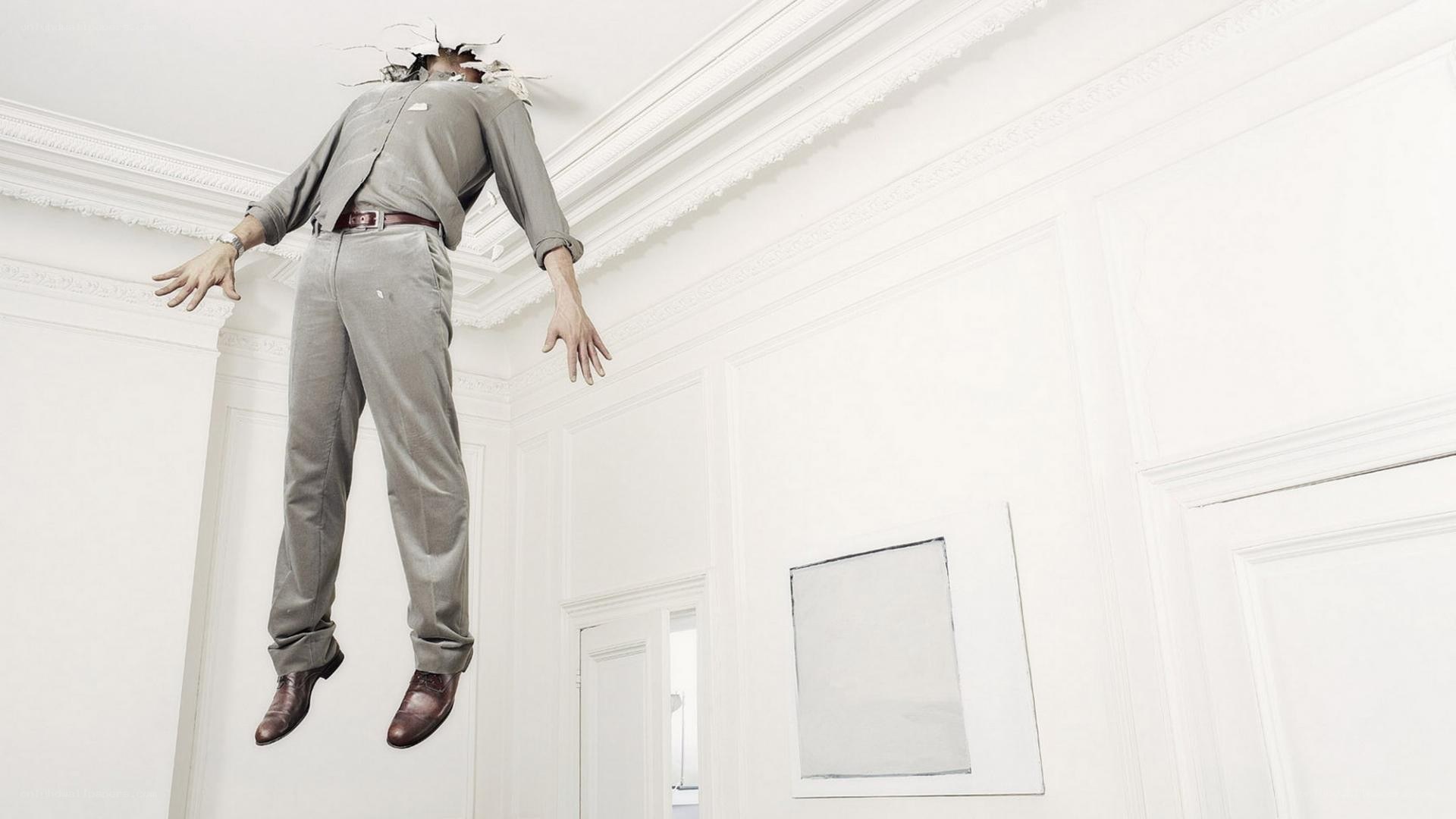 Man breaking through ceiling