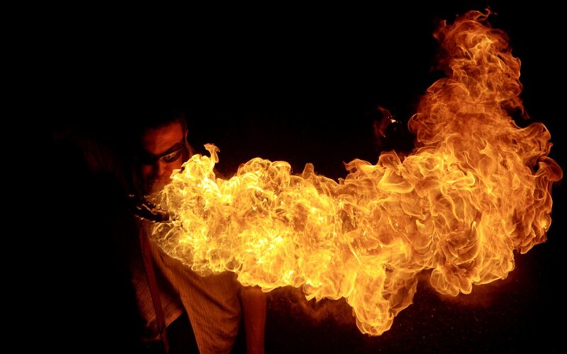 Man Breathing Fire — Orange, Dramatic, Night