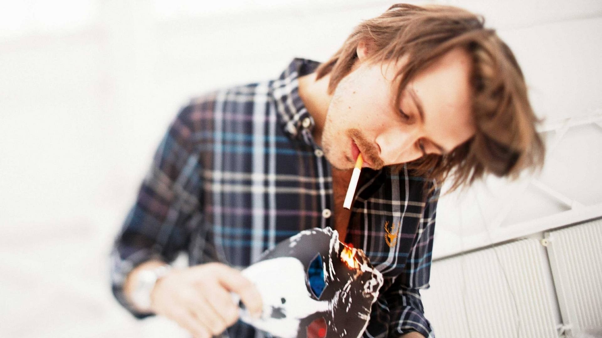 man burning a mask
