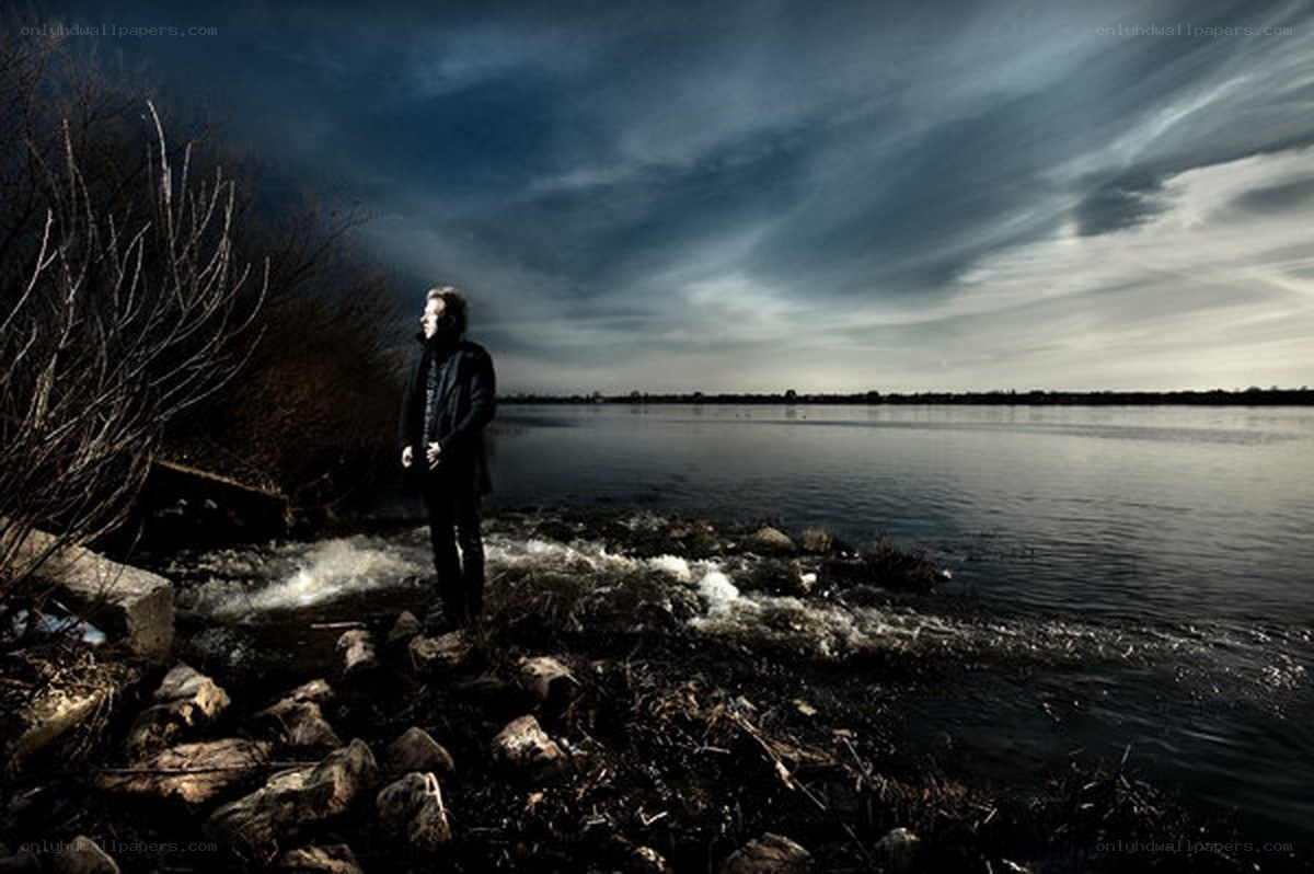 Man by the water's edge