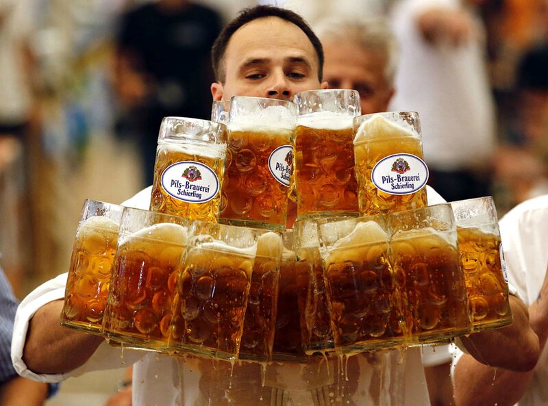 Man Carrying Beer Mugs