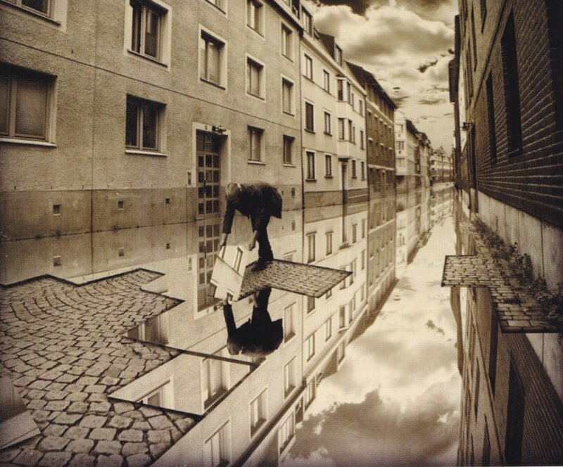man carrying box on rooftop