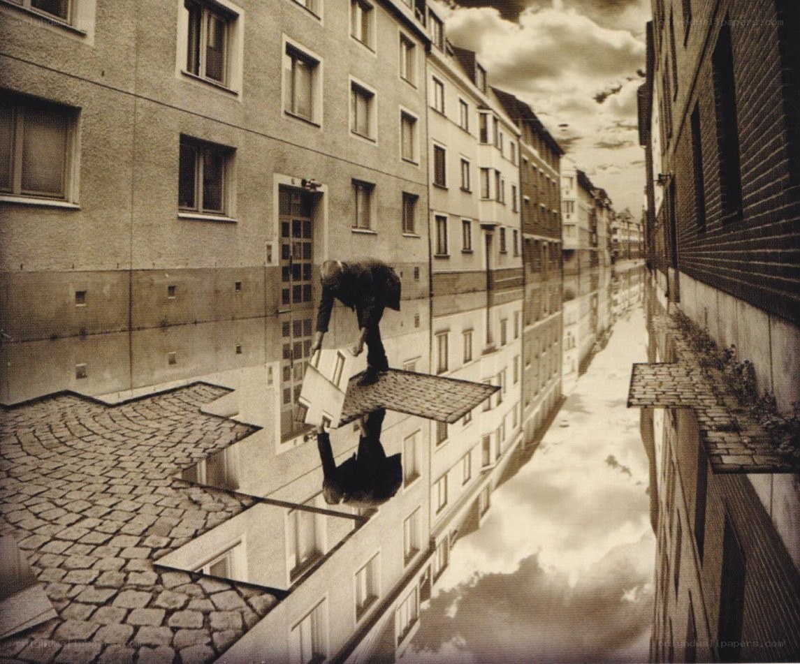 man carrying box on rooftop