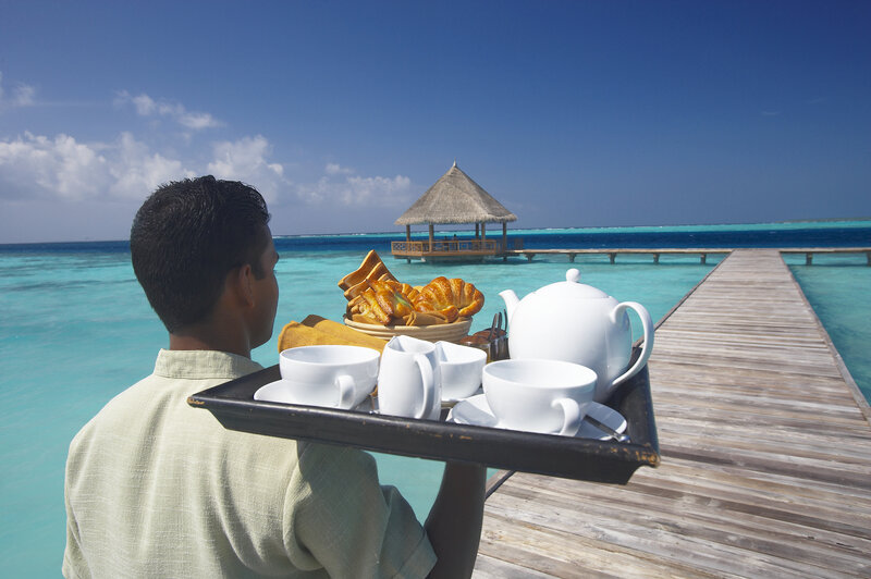 Man Carrying Breakfast Tray
