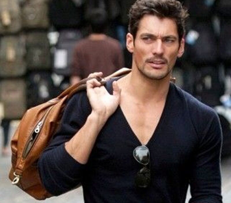 Man Carrying Brown Bag