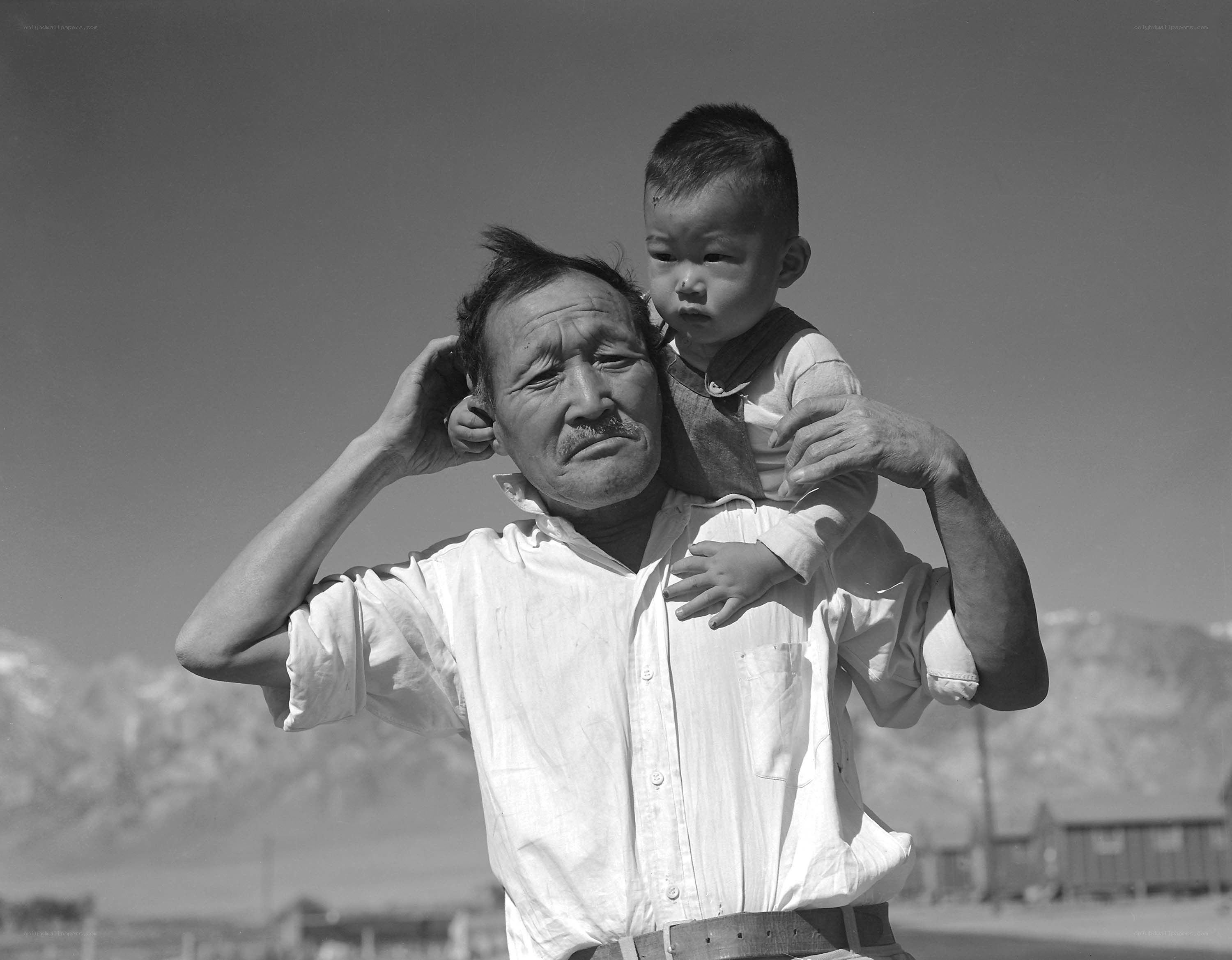 Man carrying child on shoulders