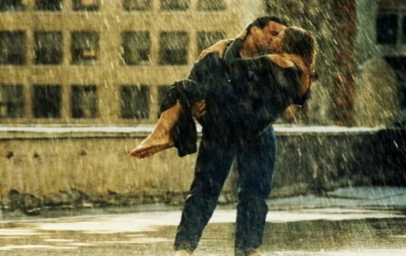 Man Carrying Woman in Rain — Brown