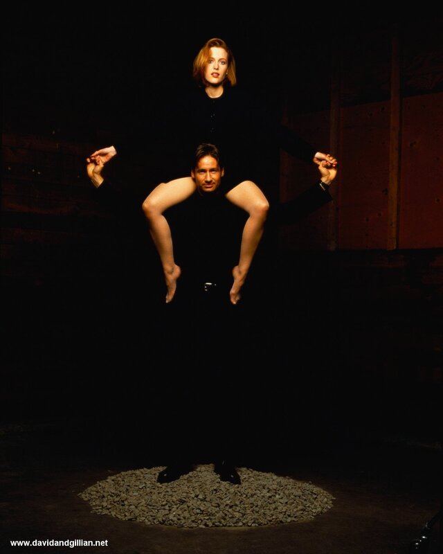 man carrying woman on shoulders