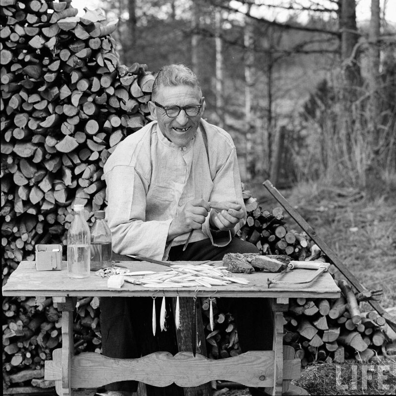 Man carving wooden objects