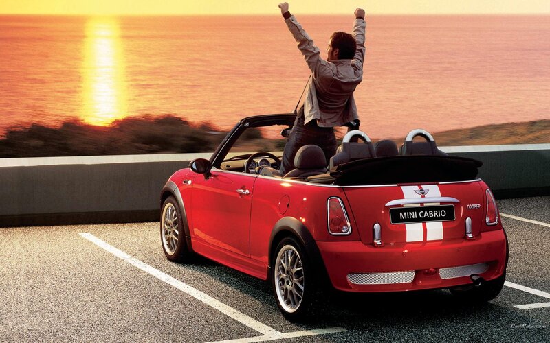 Man celebrating in red MINI Cabrio