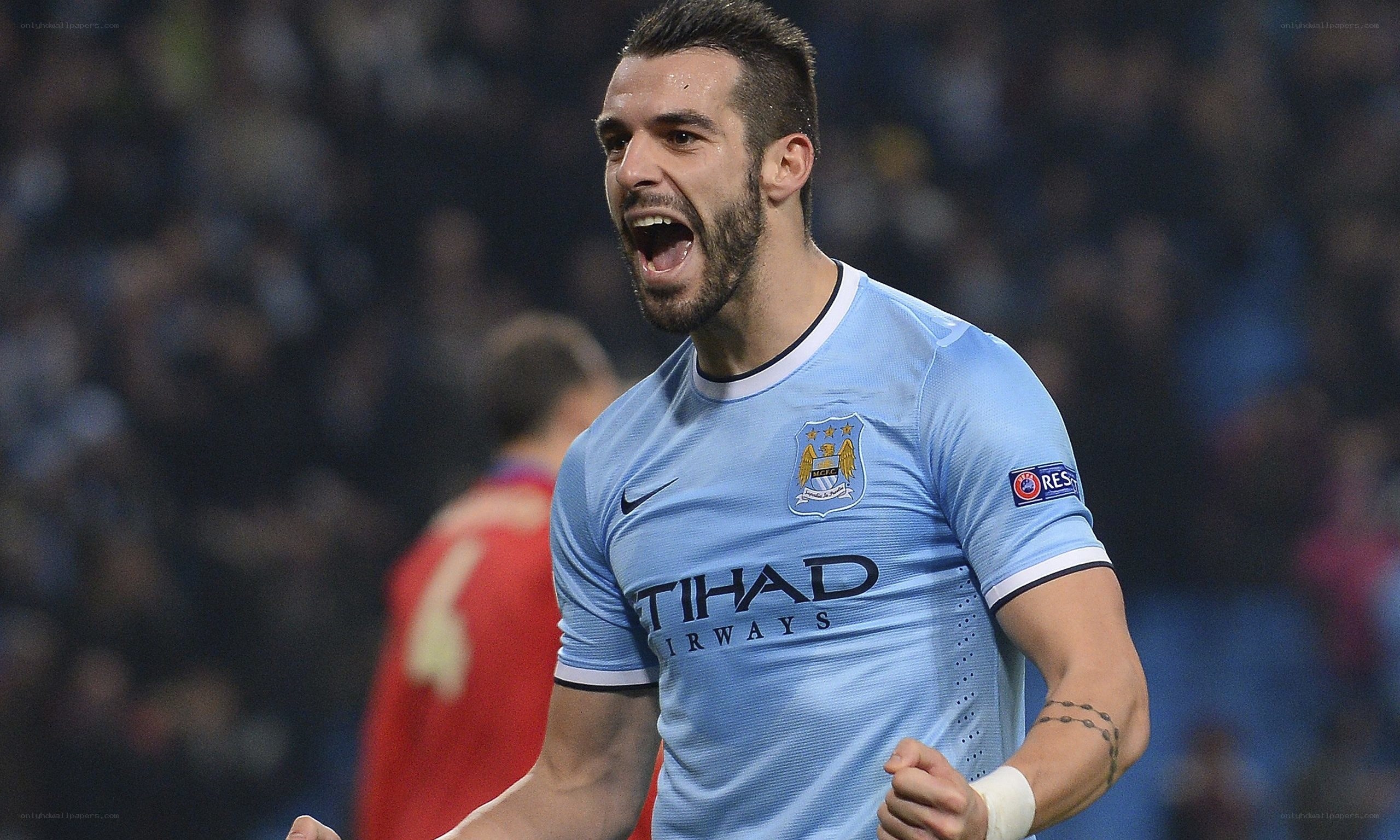 Man celebrating in soccer jersey