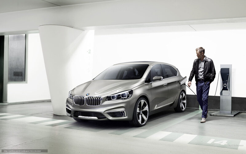 man charging electric car
