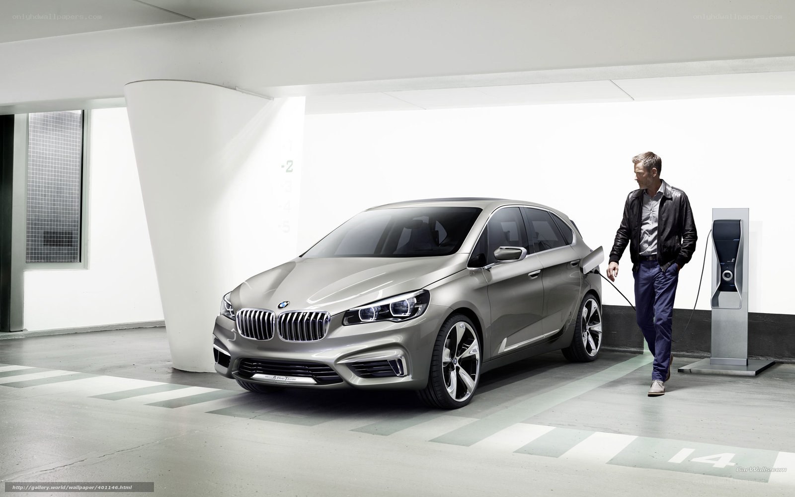man charging electric car