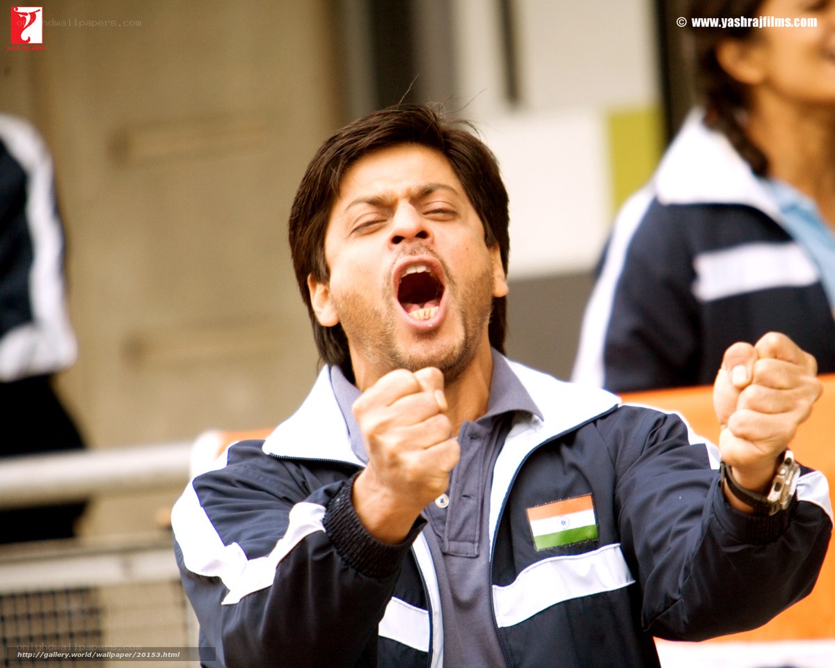 man cheering in sports jacket