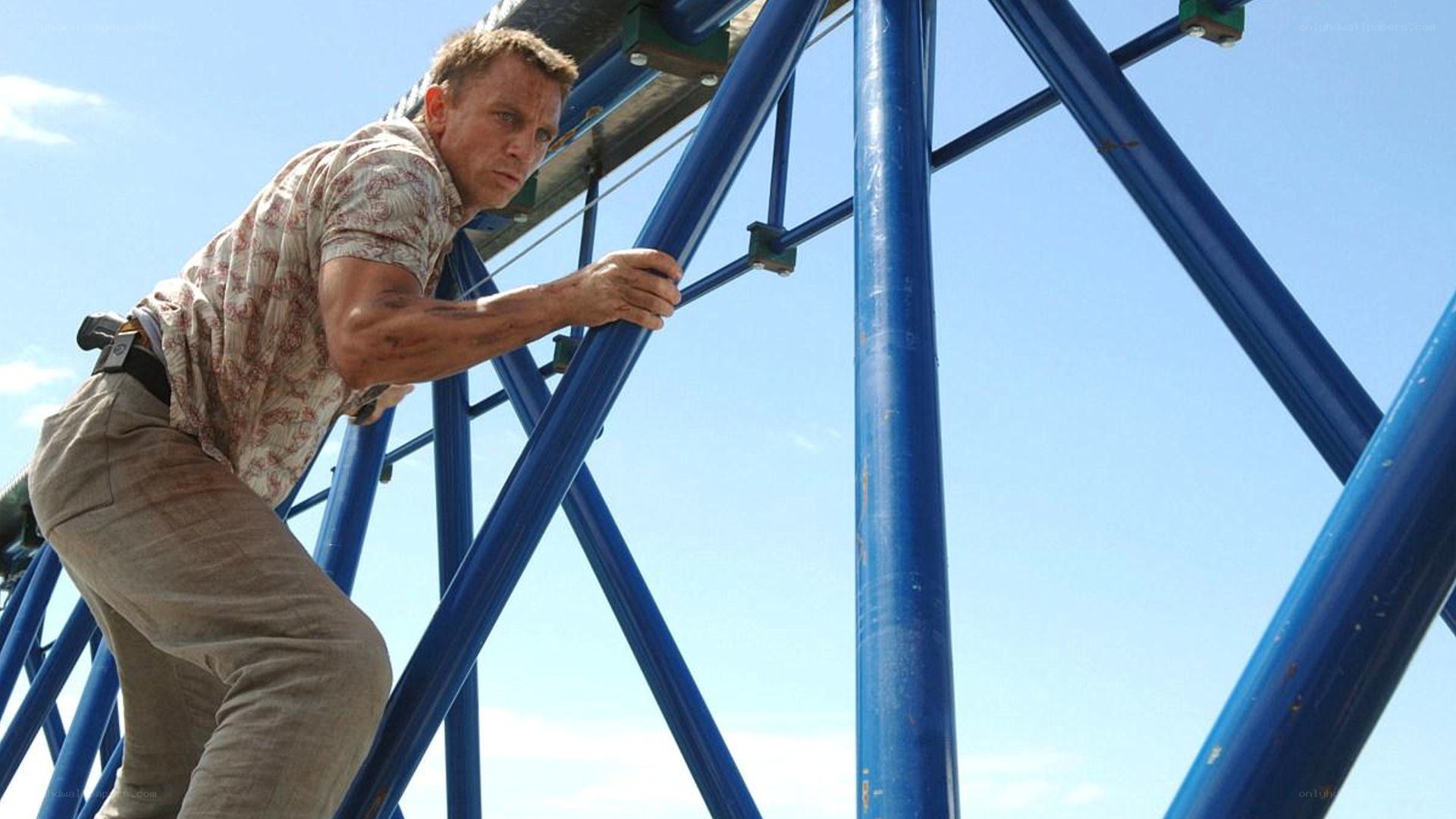 man climbing blue structure