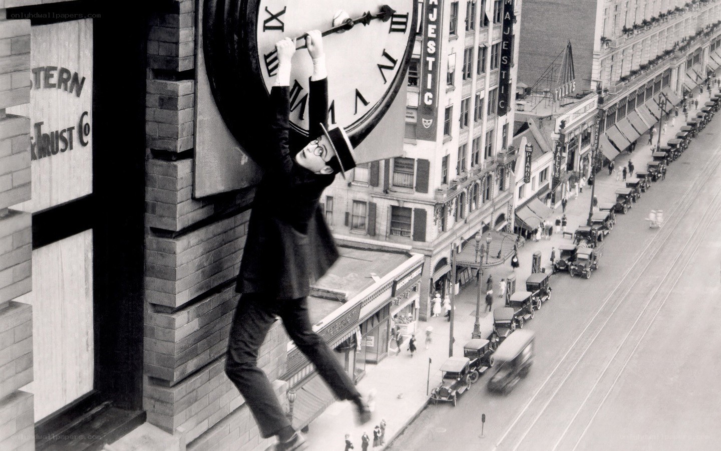 Man climbing clock face