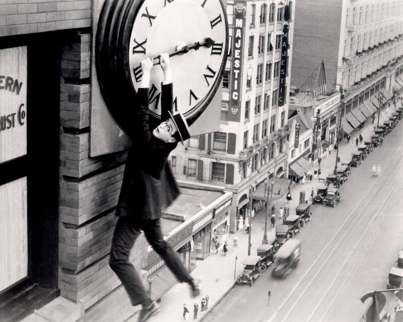 Man climbing clock face