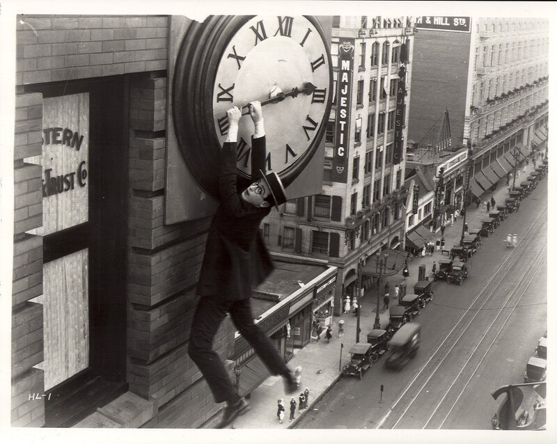 Man climbing clock face