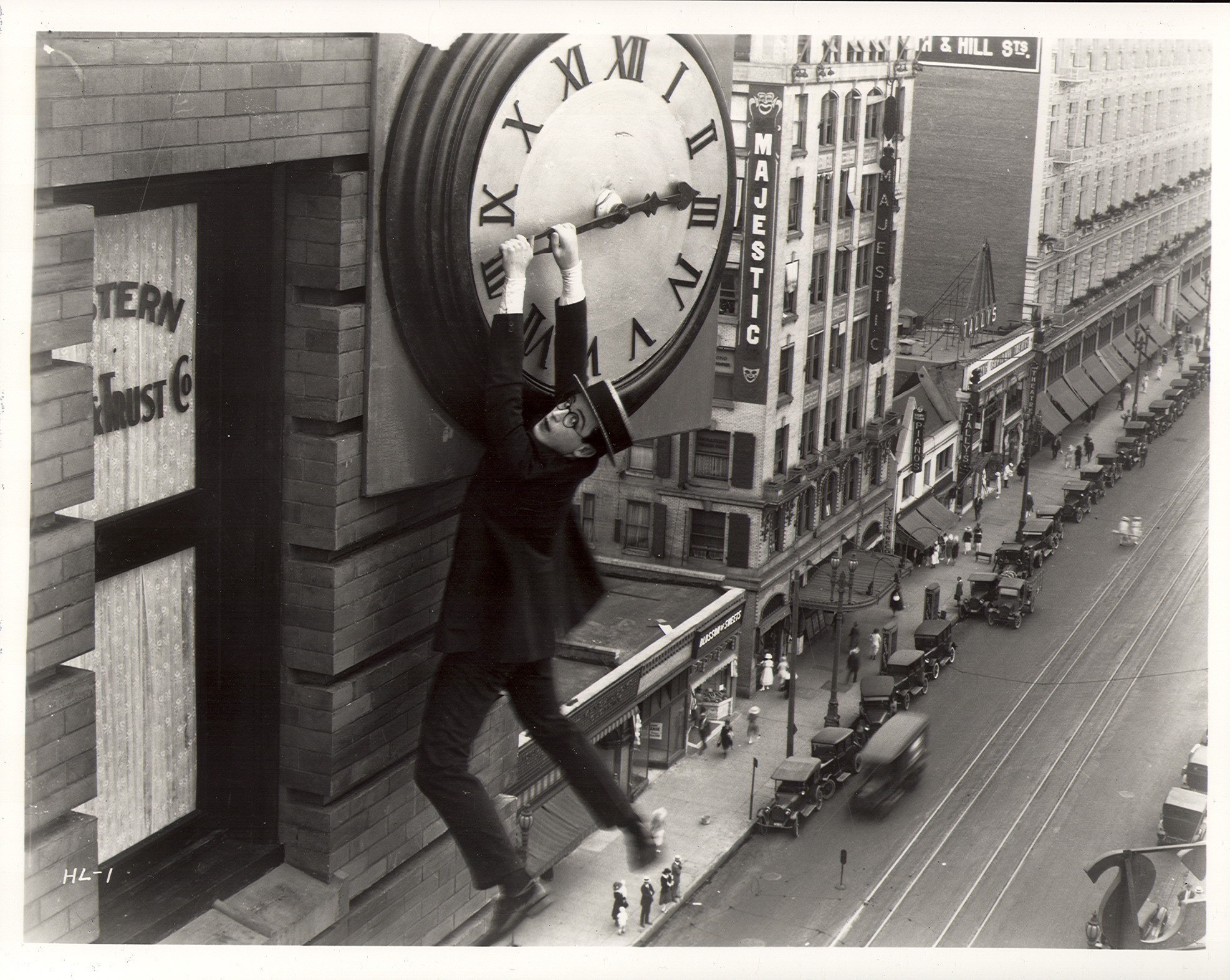 Man climbing clock face