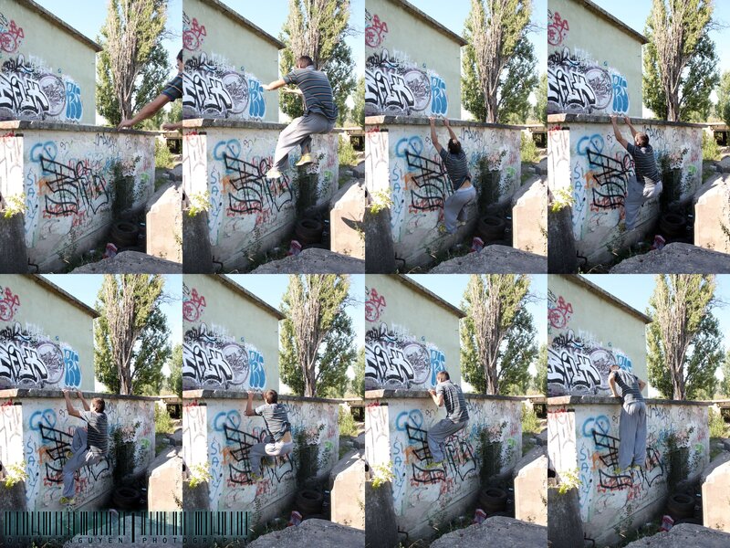 man climbing graffiti wall