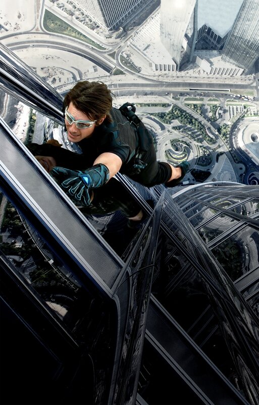 man climbing skyscraper