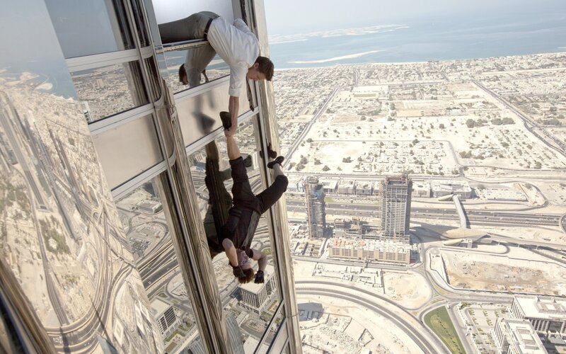Man Climbing Skyscraper — Gray, Dramatic
