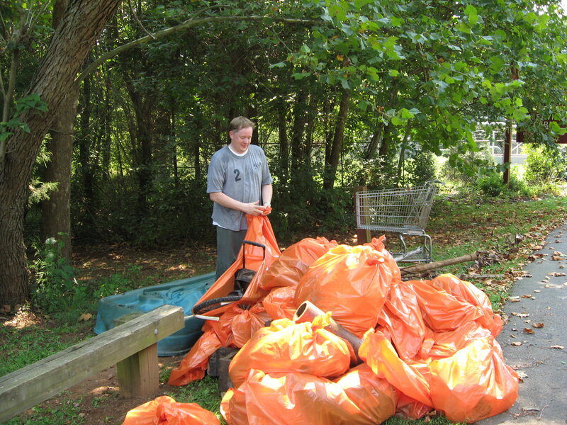 Man collecting trash in park