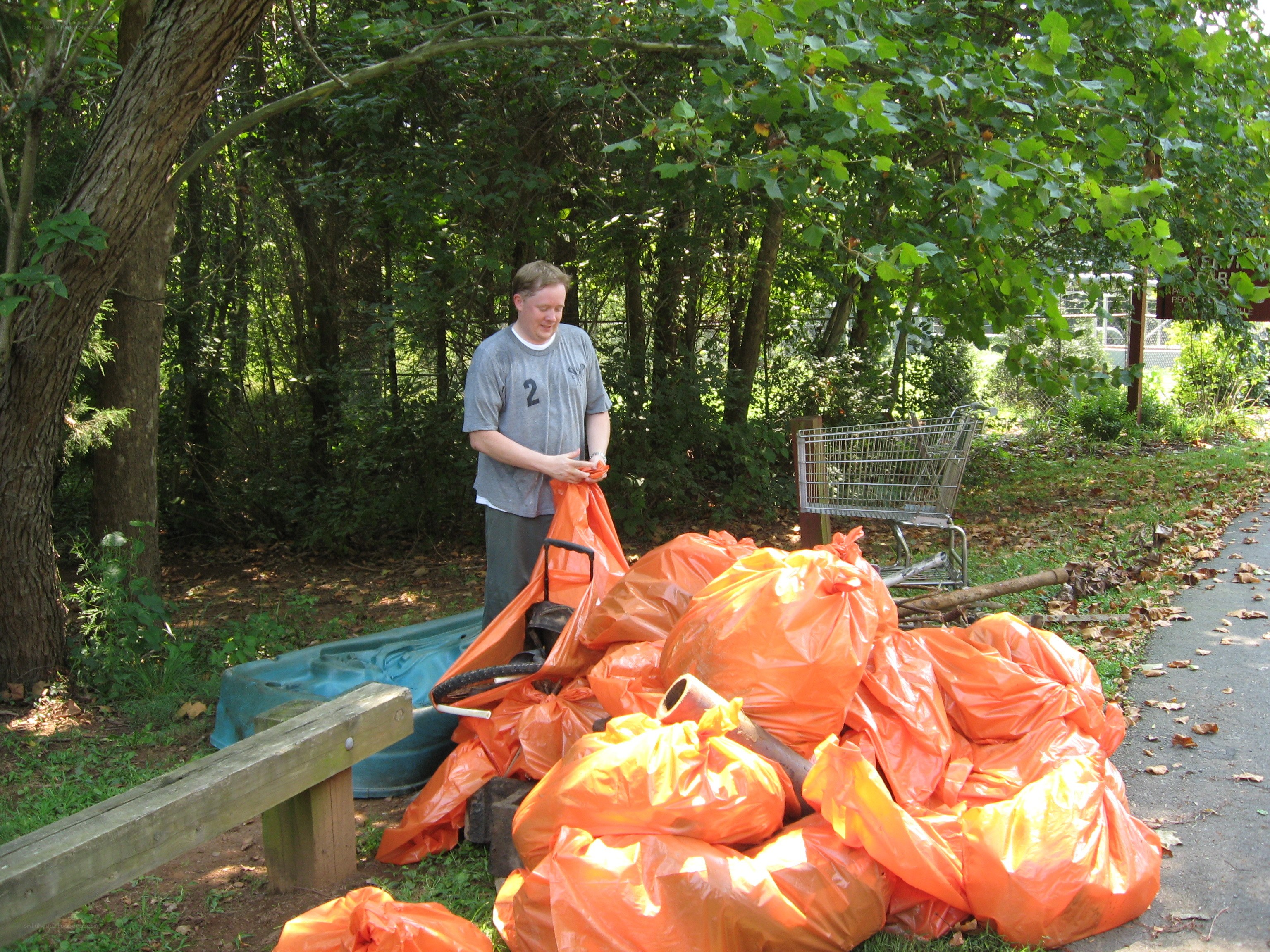 Man collecting trash in park