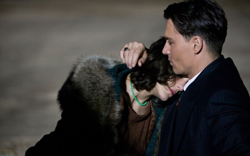 man comforting woman