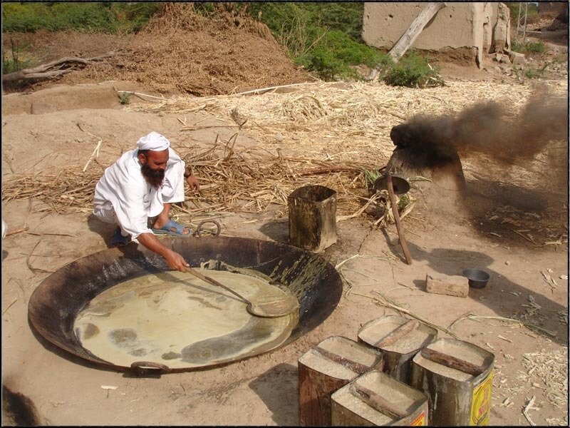 Man cooking in a large pan