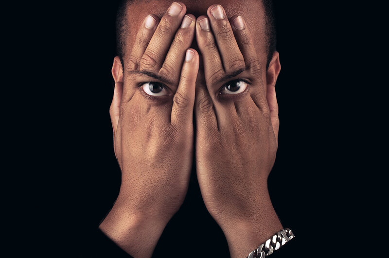 Man Covering Eyes
