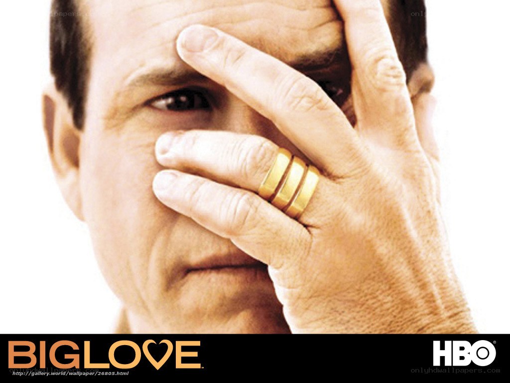 man covering face with hand