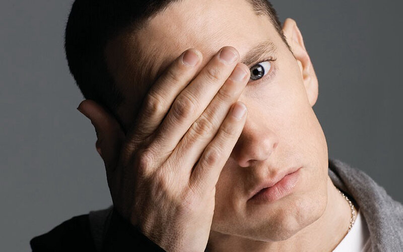 Man Covering One Eye