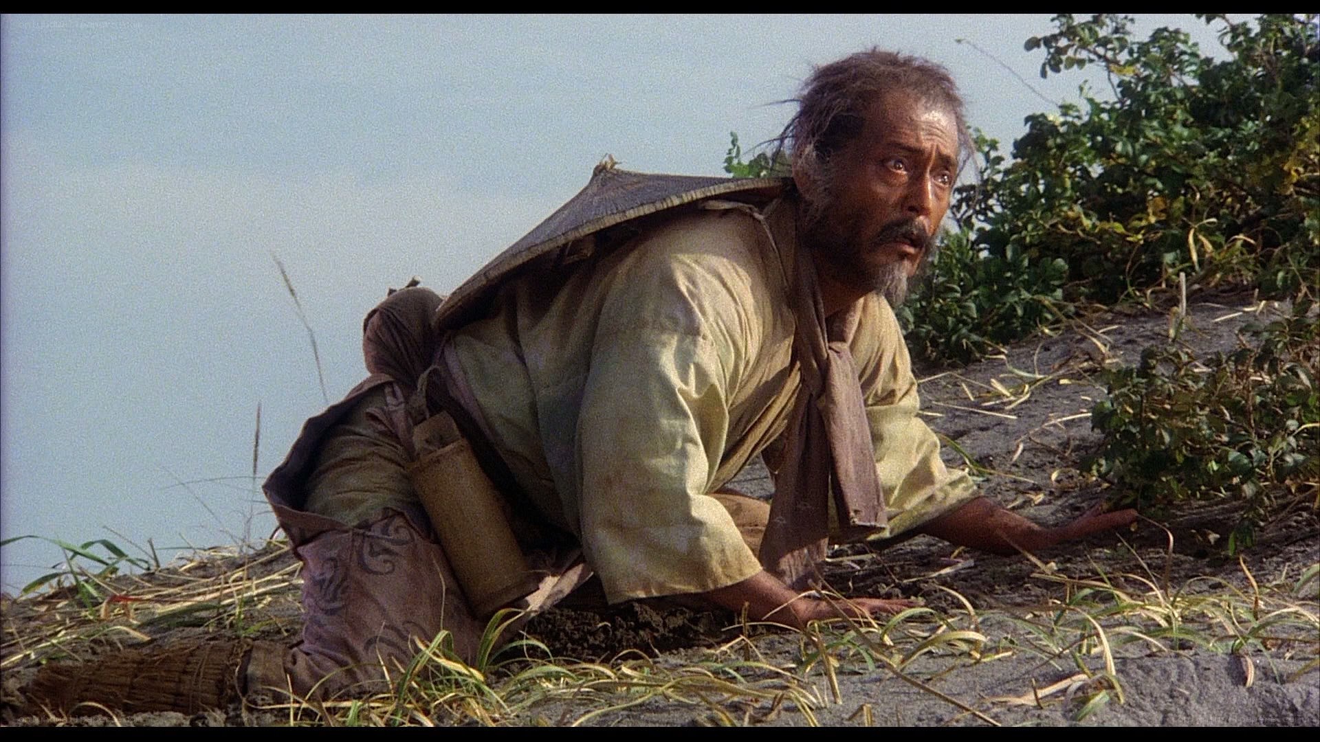 man crawling on rocky ground