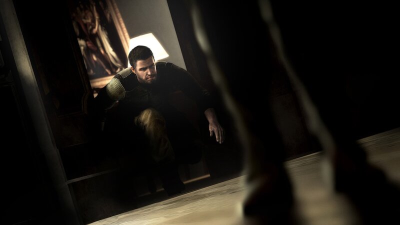 Man Crouching in Hallway