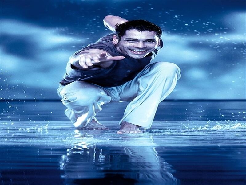 Man Crouching in Water