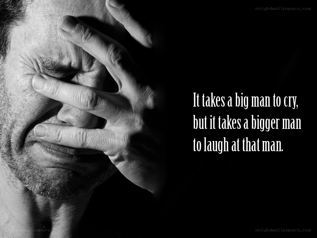 man crying with hand over face