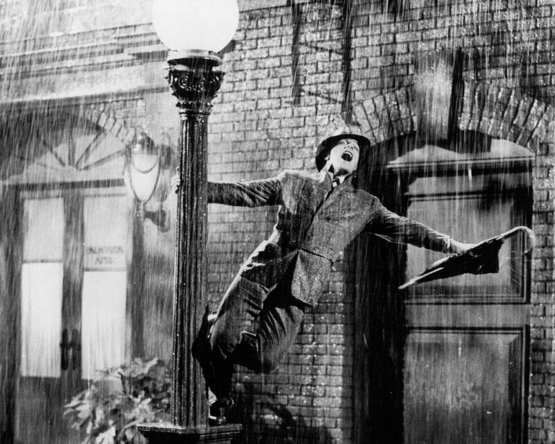 Man Dancing in Rain — Black, Joyful