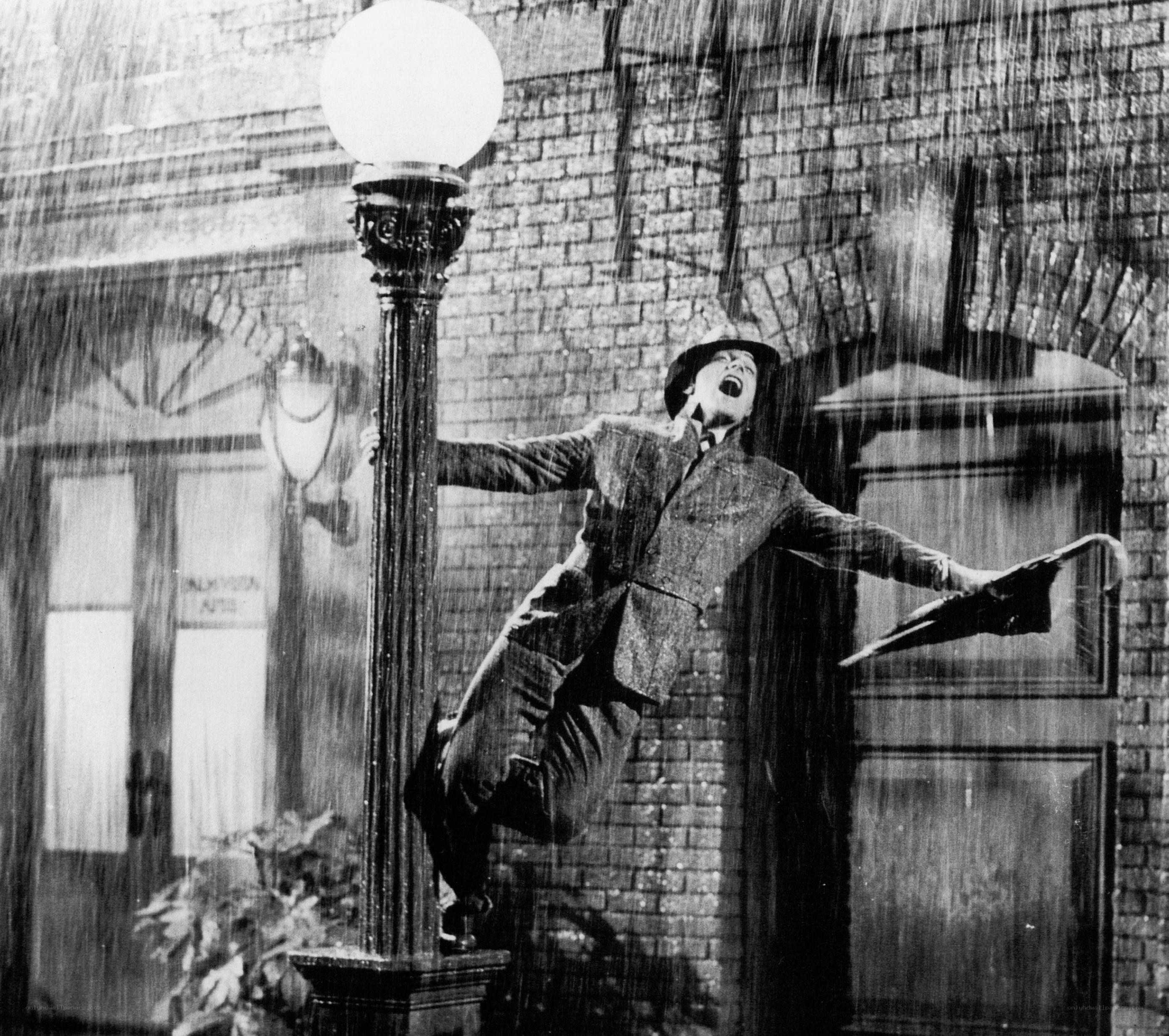 man dancing in the rain