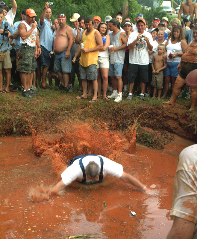 Man diving into mud pit