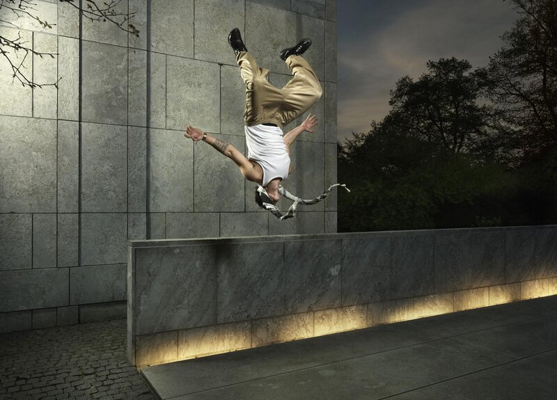 Man Doing Acrobatic Flip — Gray