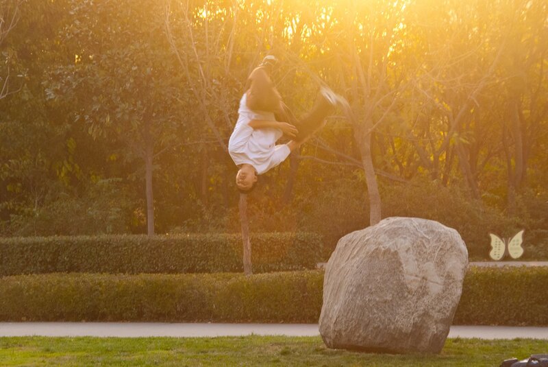 Man Doing Acrobatic Flip — Yellow