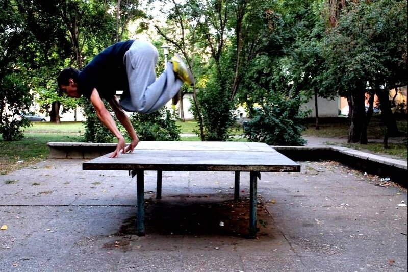 Man Doing Acrobatic Move — Green, Active, Afternoon