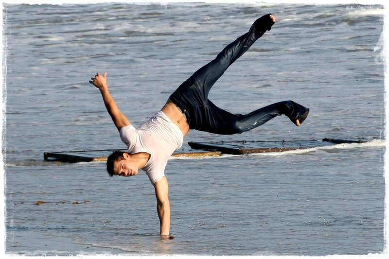 Man Doing Handstand in Water