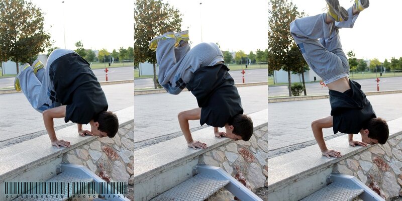 man doing handstand on ledge