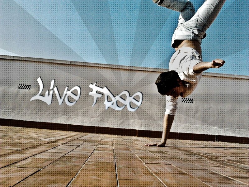 Man doing handstand on rooftop