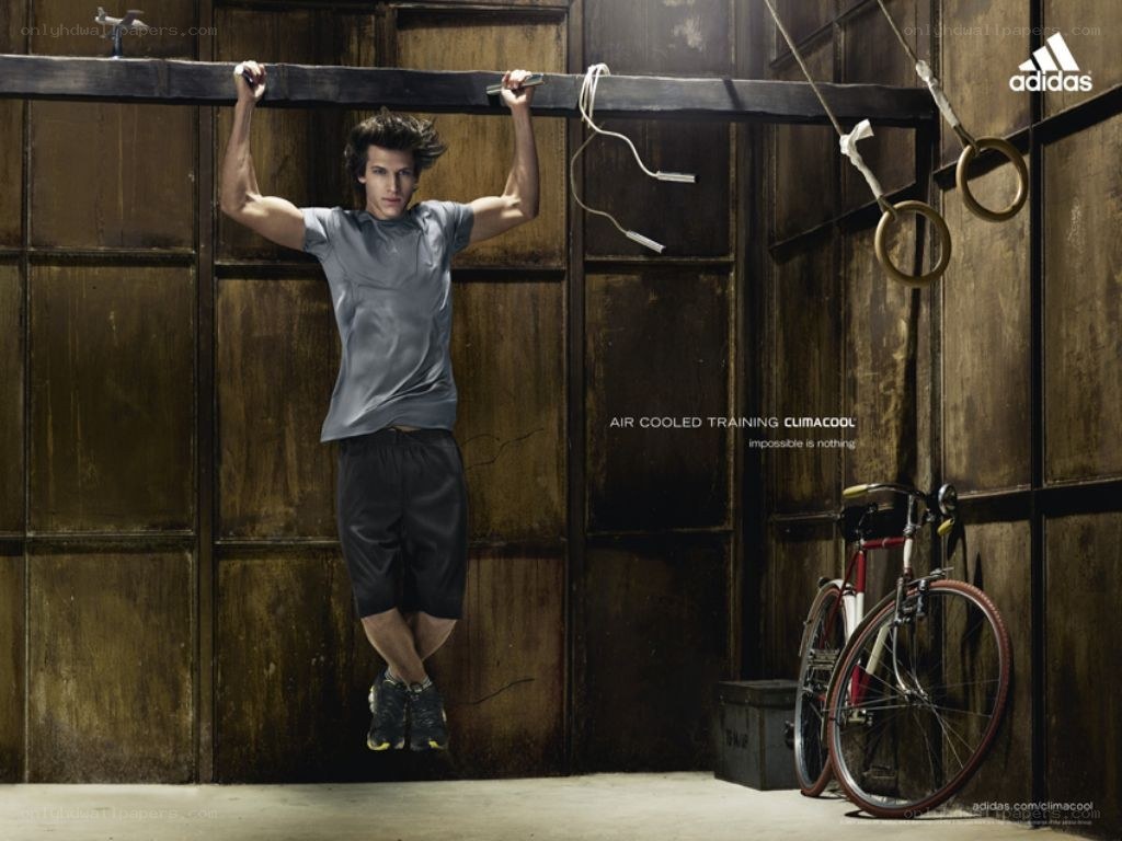 man doing pull-ups in gym