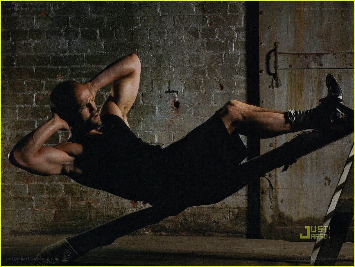 man doing sit-ups in warehouse