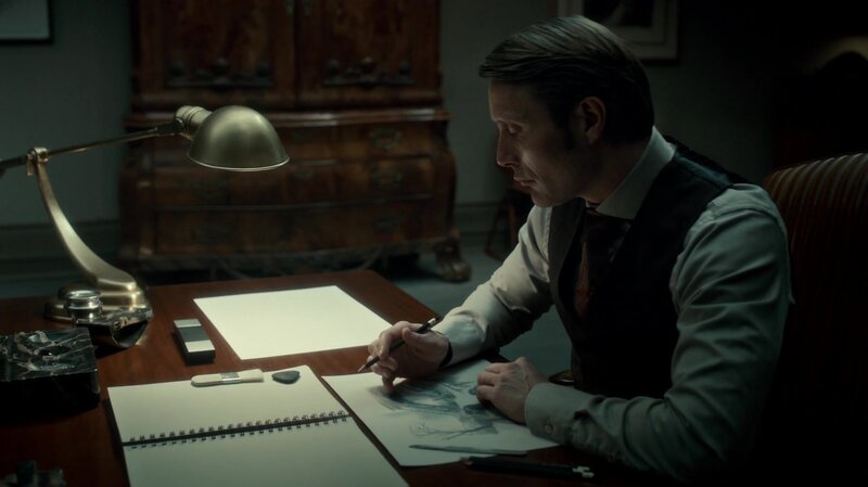 Man Drawing at Desk